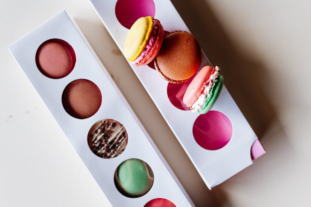 A box of pastel macarons